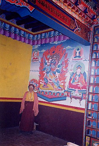 Karma Thinley Rinpoche in same shrineroom beside painting of Vajrakilaya and true likeness of Chogyur Lingpa